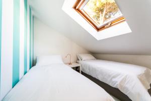 A bed or beds in a room at Bibi Home