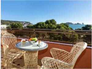 a table and chairs on a balcony with a view at Salles Beach Duplex Apartamento 45 in L'Estartit