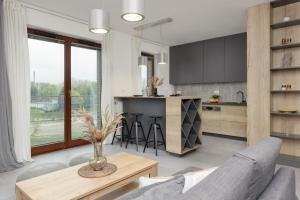 A kitchen or kitchenette at Okrzei 8 - Apartment with 2 balconies by Renters