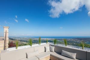 a view of the ocean from the balcony of a house at Villa Golden Hill in Chania Town