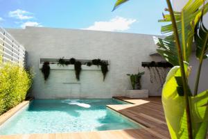 a swimming pool in the backyard of a house at 11Suites in Aigio