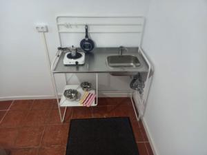 a small kitchen with a sink and a table at Candelaria Estudio1-Garoé in Candelaria