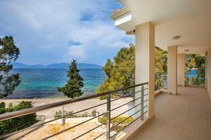 a balcony with a view of the ocean at Eucalyptus suite sea view in Karavomylos