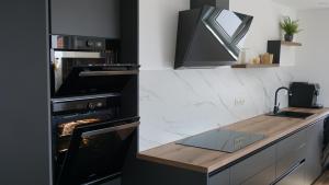Kuchyň nebo kuchyňský kout v ubytování Apartments Jozef