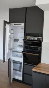 Kuchyň nebo kuchyňský kout v ubytování Apartments Jozef
