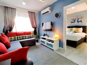 a bedroom with a bed and a couch at Central and Fully Furnished Flat in Muratpasa in Antalya