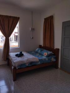 Ένα ή περισσότερα κρεβάτια σε δωμάτιο στο ROOM STAy TOK WAN 2