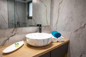 a bathroom with a large bowl sink on a counter at Magdalena Suite 2.0 in Heraklio