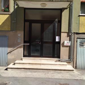 an open door of a building with stairs at Daniele's flat in Venice Mestre in Mestre