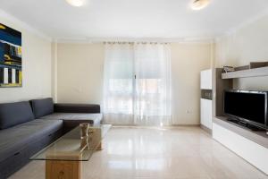 A television and/or entertainment centre at Las Brisas Playa San Juan