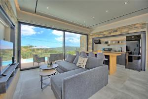 A kitchen or kitchenette at Villa Kallos by PosarelliVillas