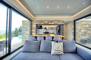 A seating area at Villa Kallos by PosarelliVillas
