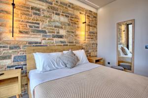 A bed or beds in a room at Villa Kallos by PosarelliVillas