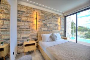 A bed or beds in a room at Villa Kallos by PosarelliVillas