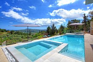 The swimming pool at or close to Villa Kallos by PosarelliVillas