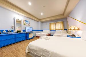 Postel nebo postele na pokoji v ubytování I HI Sanduo Travel Hotel