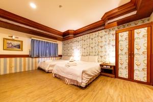 Postel nebo postele na pokoji v ubytování I HI Sanduo Travel Hotel