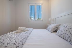 Posteľ alebo postele v izbe v ubytovaní Apartamentos DOM ROOM