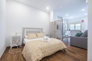 Posteľ alebo postele v izbe v ubytovaní Apartamentos DOM ROOM