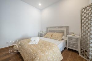 Posteľ alebo postele v izbe v ubytovaní Apartamentos DOM ROOM