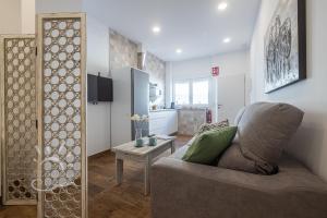 Televízia a/alebo spoločenská miestnosť v ubytovaní Apartamentos DOM ROOM