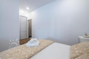 Posteľ alebo postele v izbe v ubytovaní Apartamentos DOM ROOM