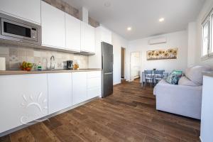 Kuchyňa alebo kuchynka v ubytovaní Apartamentos DOM ROOM