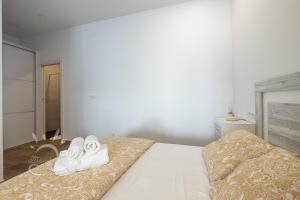 Posteľ alebo postele v izbe v ubytovaní Apartamentos DOM ROOM