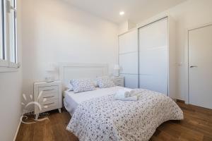Posteľ alebo postele v izbe v ubytovaní Apartamentos DOM ROOM