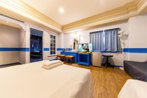 Postel nebo postele na pokoji v ubytování I HI Sanduo Travel Hotel