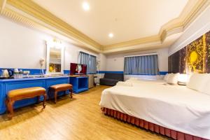 Postel nebo postele na pokoji v ubytování I HI Sanduo Travel Hotel