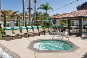 a hot tub in the middle of a patio with chairs at La Jolla 1br w gym wd pool nr bars shops SAN-7 in San Diego