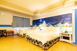 Postel nebo postele na pokoji v ubytování I HI Sanduo Travel Hotel