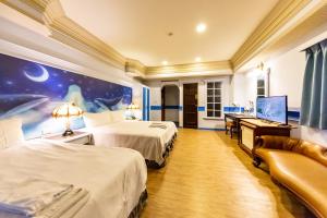 Postel nebo postele na pokoji v ubytování I HI Sanduo Travel Hotel