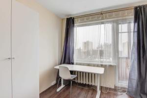 a white desk in a room with a window at Žirmūnų st 115 Vilnius Students Home LT in Vilnius