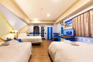 Postel nebo postele na pokoji v ubytování I HI Sanduo Travel Hotel