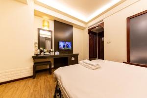 Postel nebo postele na pokoji v ubytování I HI Sanduo Travel Hotel