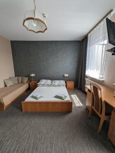 Łóżko lub łóżka w pokoju w obiekcie Motel DRABEK
