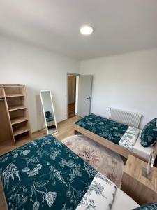 Łóżko lub łóżka w pokoju w obiekcie Gîte d'Esila