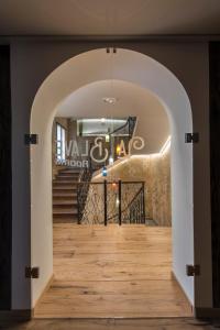 an archway leading to a staircase in a building at La Blave Rooms in Mortegliano
