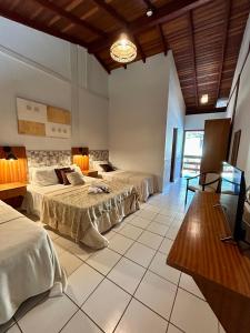 Cama ou camas em um quarto em Recanto Verde Praia Hotel Juquehy