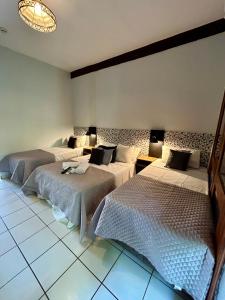 Cama ou camas em um quarto em Recanto Verde Praia Hotel Juquehy