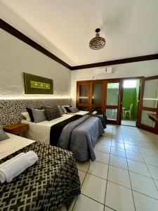 Cama ou camas em um quarto em Recanto Verde Praia Hotel Juquehy