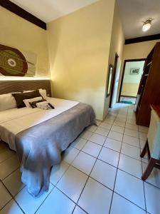 Cama ou camas em um quarto em Recanto Verde Praia Hotel Juquehy
