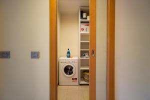 a laundry room with a washer and a washing machine at APPARTAMENTO MACIACHINI, ZONA ISOLA in Milan