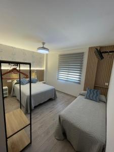 Posteľ alebo postele v izbe v ubytovaní Hostal Calderón de la Barca