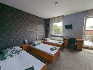 Łóżko lub łóżka w pokoju w obiekcie Motel DRABEK