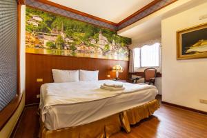 Postel nebo postele na pokoji v ubytování I HI Sanduo Travel Hotel