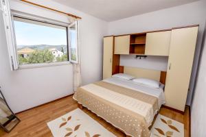 Postel nebo postele na pokoji v ubytování Apartments Mirta