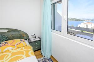 Postel nebo postele na pokoji v ubytování Apartments Mirta